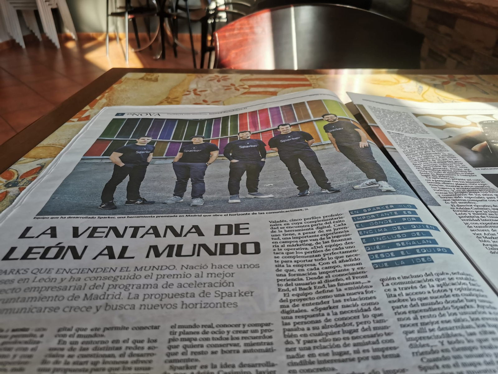 Photograph in a cafeteria of a newspaper with an article of Sparker